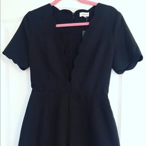 Black scallop romper from Nordstrom. Never worn.